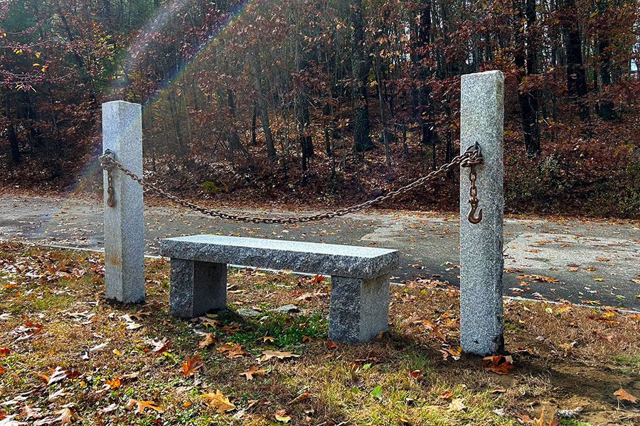 A lovely Granite post with a light attached to it.