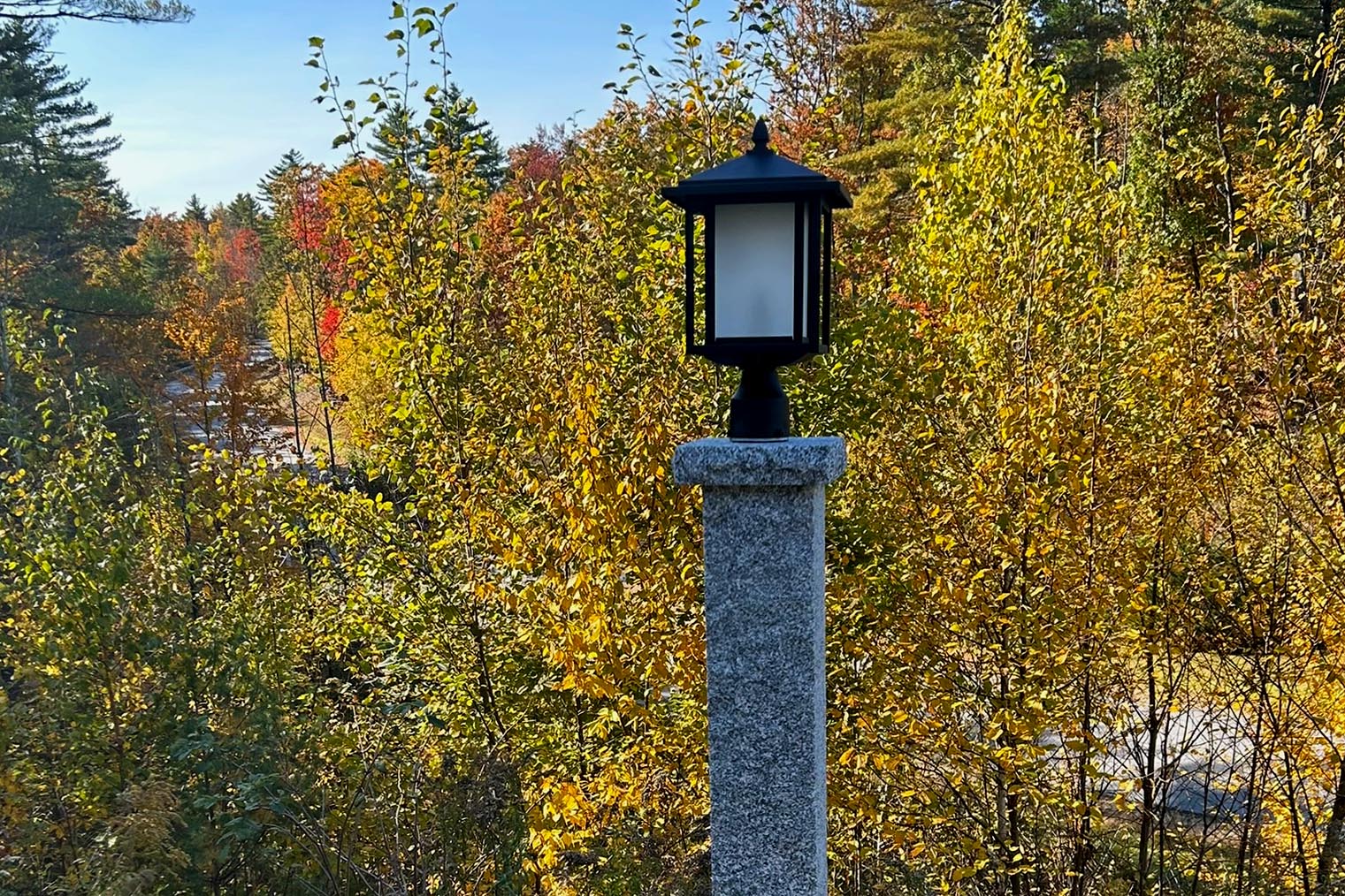 A lovely Granite post with a light attached to it.