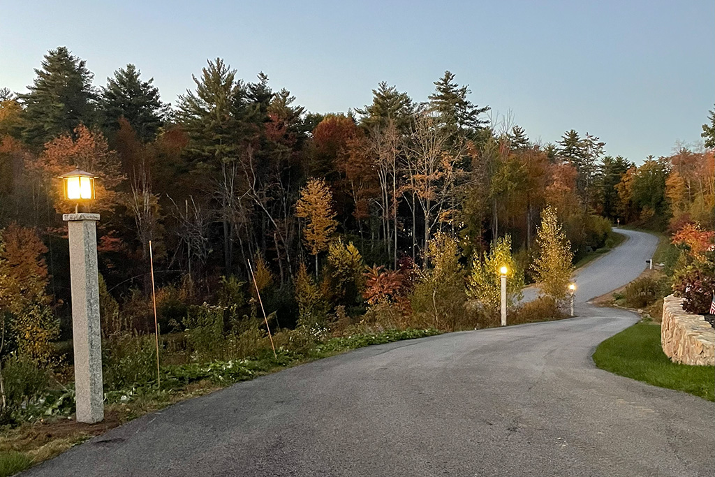 A lovely Granite post with a light attached to it.